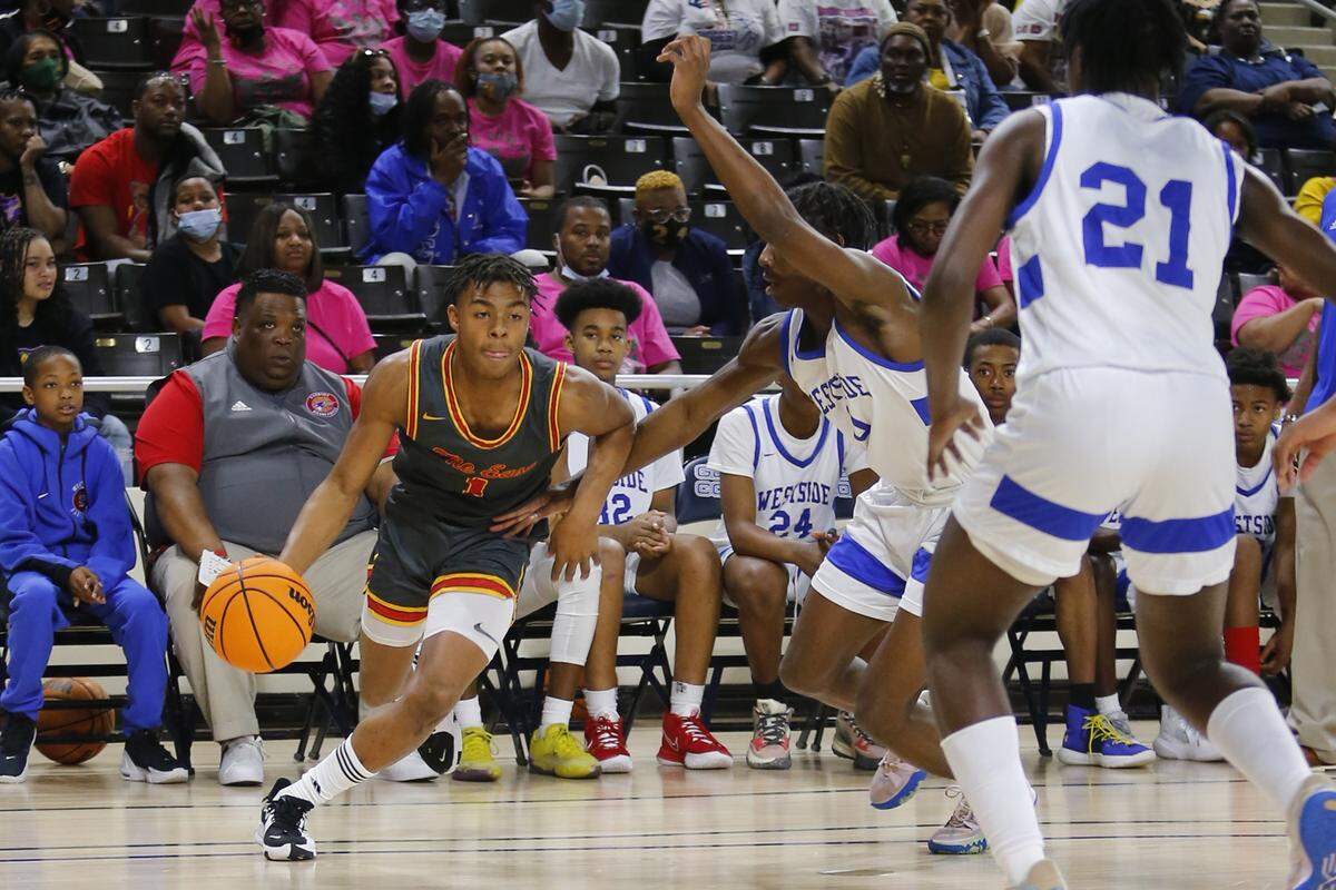 Northeast guard Travion Solomon (1) drives past the defense during the Raiders’ 73-55 loss to Westside-Augusta in the GHSA 2A semifinal Friday at Georgia College and State University.