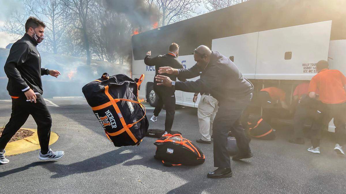 Members of the Mercer University football team were stopped at the Golden Corral on Forest Drive in Columbia, SC when one of their buses caught fire Friday, March 12, 2021. The team, who was en route to the Virginia Military Institute in Lexington, Virginia for game, was able to salvage their gear from under the bus before being damaged.