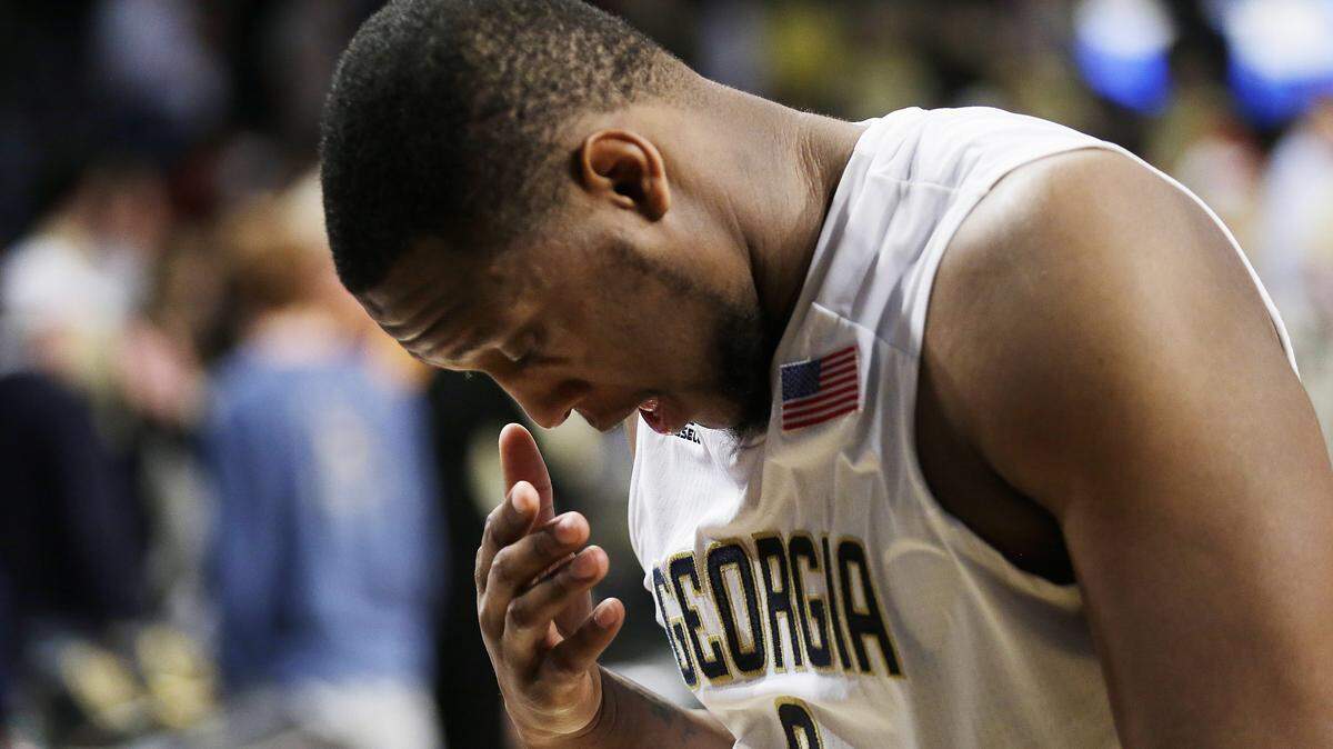 Georgia Tech's Charles Mitchell hangs his head as he walks off the court after Georgia Tech lost 78-77 to Virginia Tech in an NCAA college basketball game Saturday, Jan. 16, 2016, in Atlanta. (AP Photo/David Goldman)