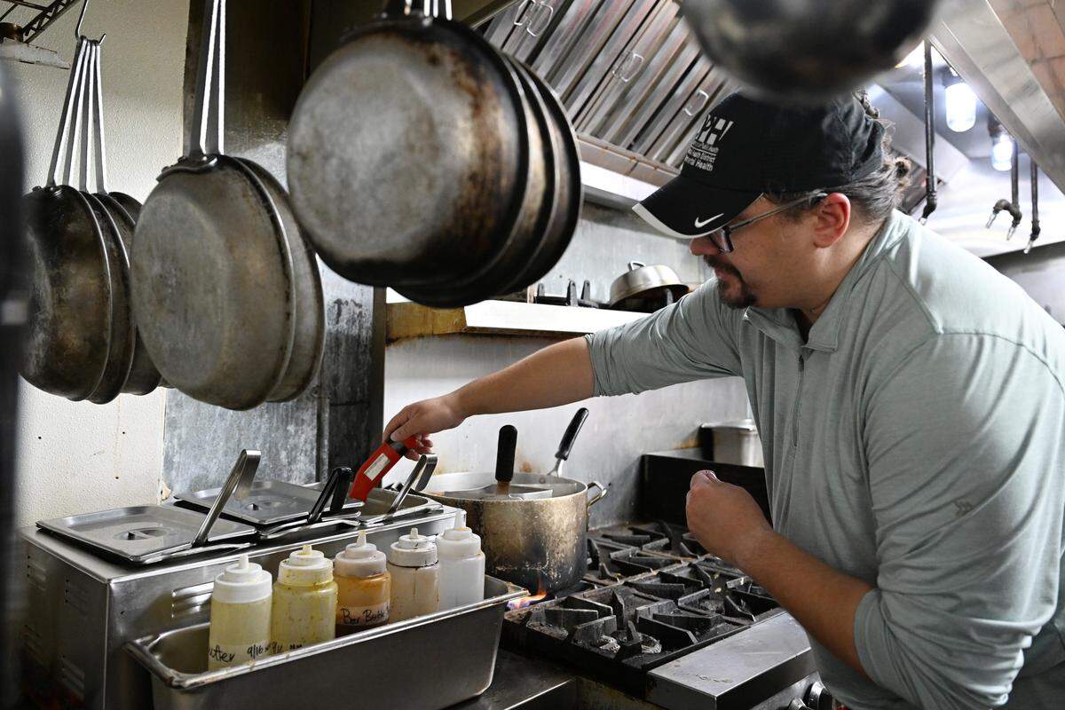 North Central Health District environmental health specialist Mark Torres-Hauck uses a thermometer during a mock health inspection on Thursday, Sept. 18, 2025, in Macon, Georgia. A restaurant’s health inspection typically takes place every six months. 
