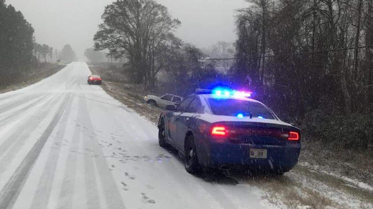 The Georgia Department of Public Safety urges people to stay off the roads, if possible, as southeast Georgia gets a dusting of snow Wednesday.  Those who must travel should drive slowly and buckle seat belts.