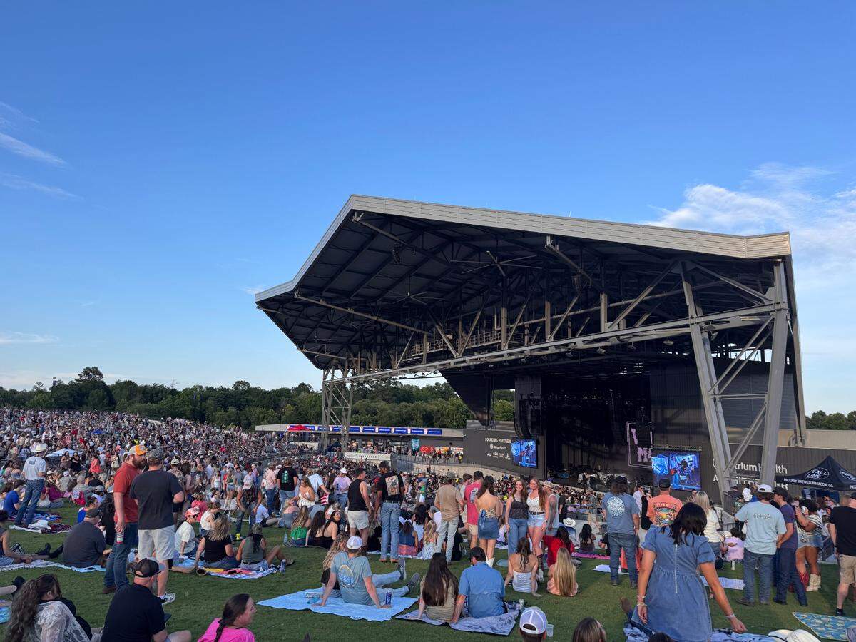 People sat out on the lawn with blankets to enjoy the Parker McCollum concert on June 28, 2025 at the Atrium Health Ampitheater. Country music stars Whiskey Meyers and Hank Williams Jr. are performing at the ampitheater later in July.