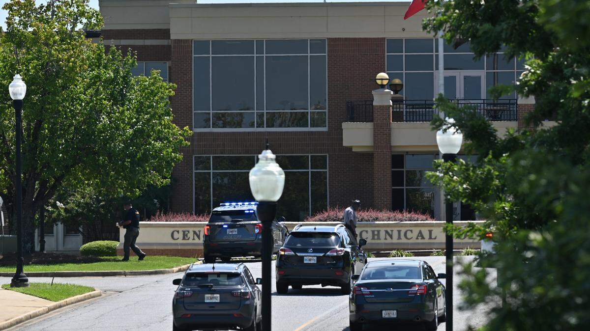 Cars reenter the Macon campus of Central Georgia Technical College after an active shooter threat on Tuesday, Aug. 26, 2025, in Macon, Georgia. Bibb County Sheriff’s Office and CGTC police found no active threat and advised those on campus to resume normal operations.