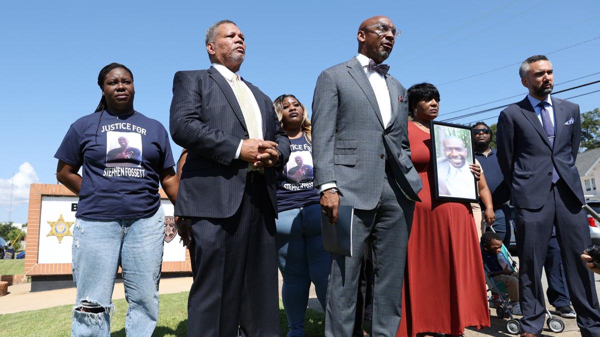 Attorneys from Davis Bozeman Law and The Fitzpatrick Firm, LLC stand with family members of Stephen Fossett during a press conference outside of the Bibb County Jail on Tuesday, Aug. 28, 2024, in Macon, Georgia. Fossett died in late May while in custody at the Bibb County Jail after experiencing a medical emergency and subsequent tasing. Now, his family have launched an investigation into circumstances of his death.