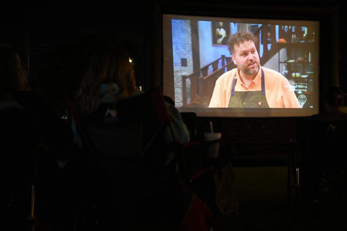 Cory Jones, owner of Sweet Evelyn’s in downtown Perry, competes on Food Network’s “Halloween Baking Championship” during a public watch party on the lawn of city hall, Monday, Oct. 20, 2025.