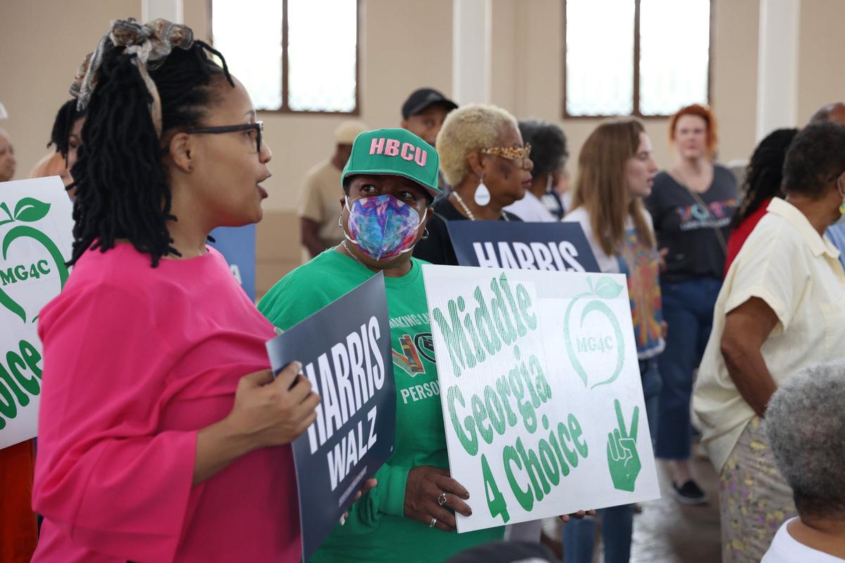 Mia Robbins-Aguilar (right) speaks with her sister Tina Hobson before the start of the the “Fighting for Reproductive Rights” bus tour stop on Friday, Sept. 6, 2024, at Carolyn Crayton Park in Macon, Georgia. Although Harris was not present, various speakers from across the state spoke at the tour stop specifically about Harris’ stance in support of abortion and reproductive rights.