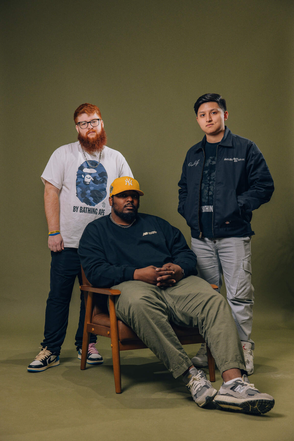 Sixth Ave owners from left, Jarredd Helms, director of operations; Marquis Burns (seated), creative director, and Michael Paredes, managing director.