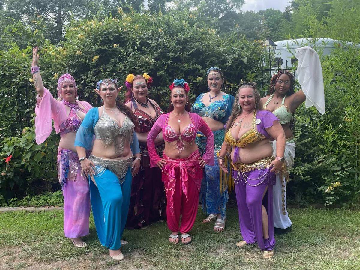 Perry Belly Dance is composed of students from level two and advanced classes at Perry Belly Dance Studio in downtown Perry. From left to right and by color of outfit, Lee Ford (pink), Jelena Lee (turquoise), Marie Keith-Winters (maroon), studio owner Trichelle Hutten (pink), Jamey Lyons-Kimsey (blue), Shelli Westbrook (purple) and Nayahna Gordon (green and white). The photo was taken at the Twilight Fairy Festival in Augusta.