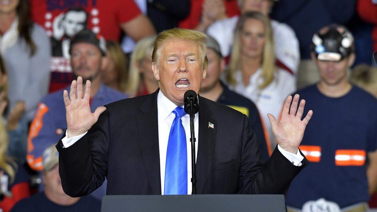 President Donald Trump reacts as he speaks to a crowd at Eastern Kentucky University on Saturday in Richmond, Ky.