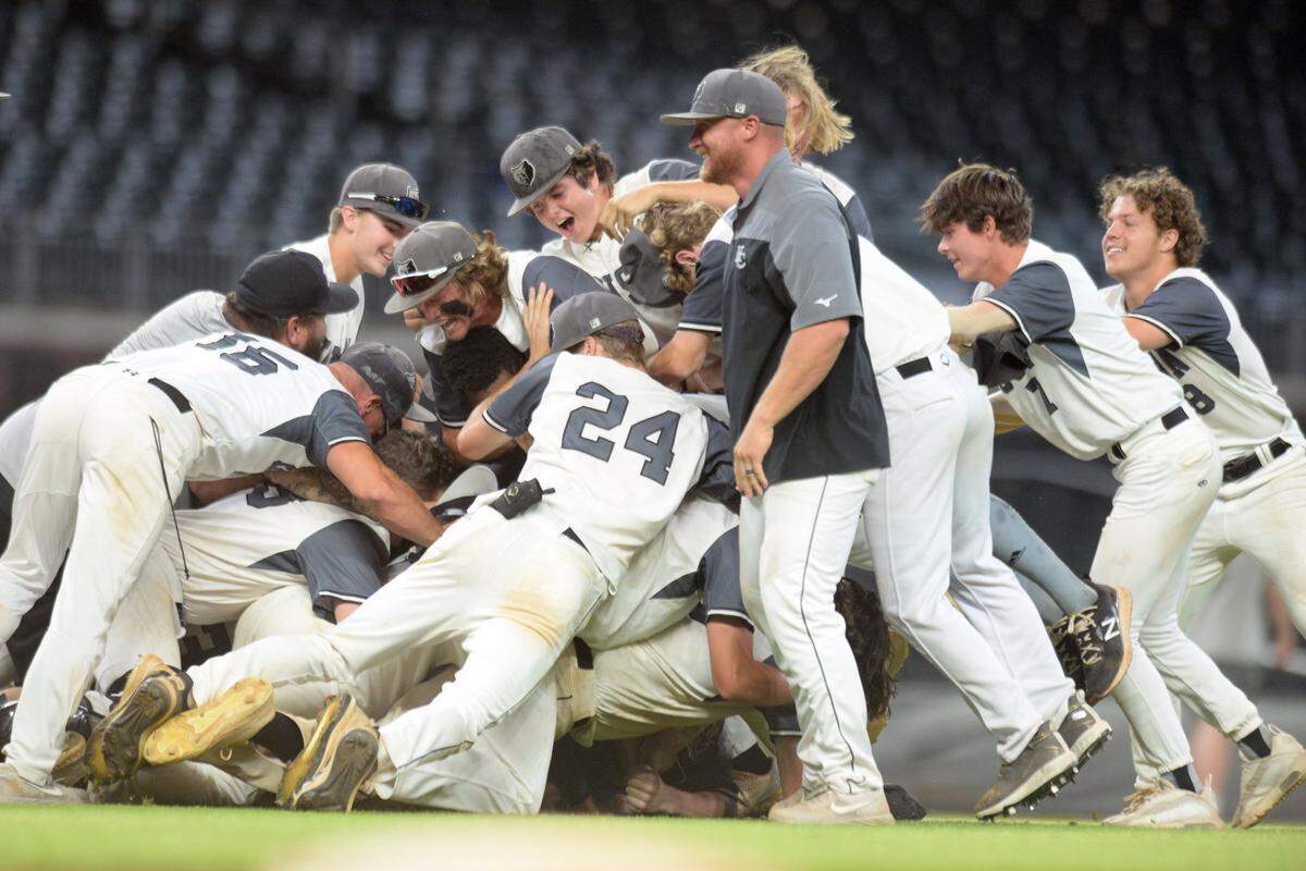 Houston County players celebrate their GHSA 6A Championship series win over Lassiter Wednesday in Atlanta.