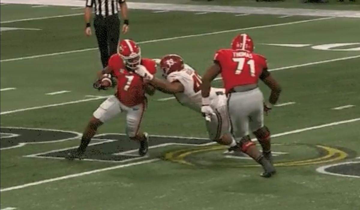 D'Andre Swift had his facemask grabbed on this play, which did not get called.