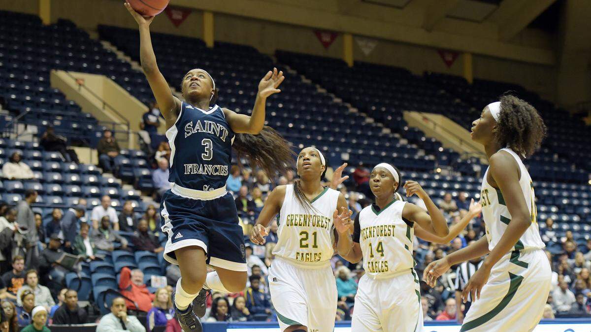 St. Francis guard Taja Cummings (3) lays one in against Greenforest Christian during the GHSA Class A Private girls basketball championship Saturday at the Macon Coliseum.