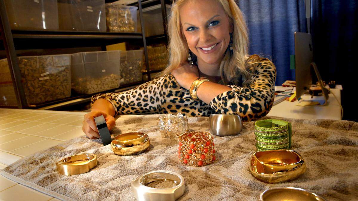 Cynthia Blais, founder and owner of Funktional Wearables, displays some of her products at her company in San Diego. Blais designs and makes jewelry that disguises fitness tracker devices such as the Fitbit in a wide variety of bracelet designs.