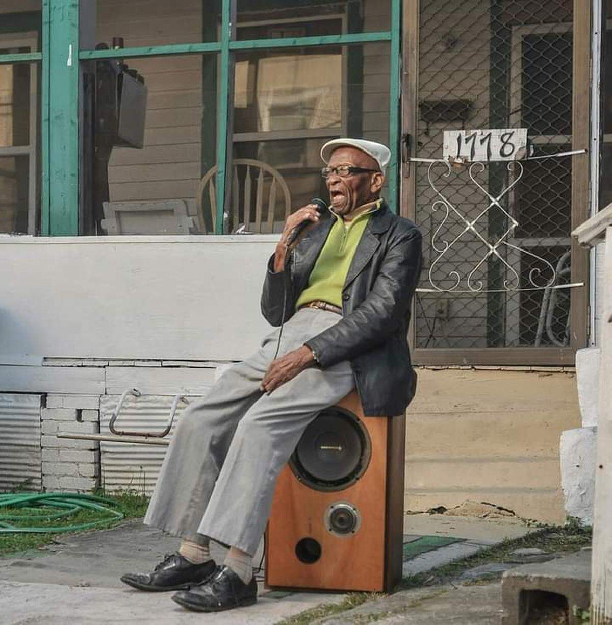 Buddy Barron sings while sitting on a speaker as part of the Macon Music Project, a photography documentary started by his grandson Dsto Moore.