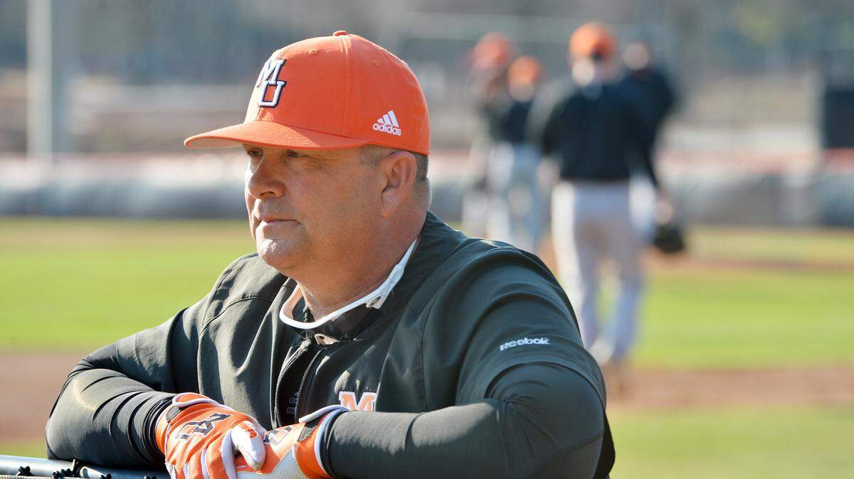 Mercer baseball head coach Craig Gibson keeps a close eye on his pitchers as they warm up in the bullpen.