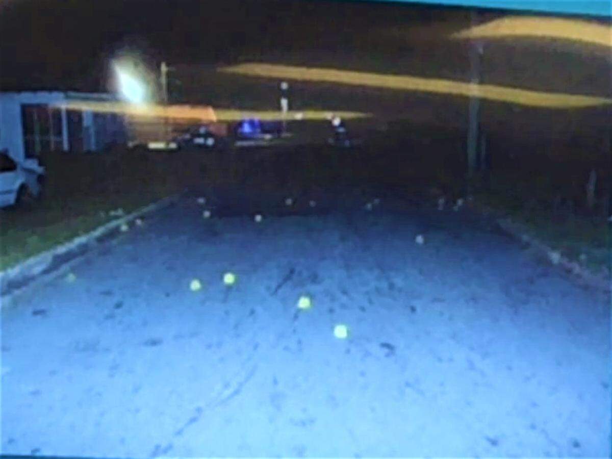 Shell casings litter Mason Street near the intersection of Carroll Street.