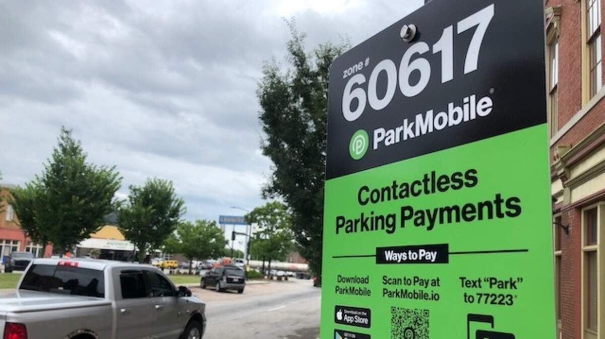 Park Macon’s new green signs provide digital payment instructions and also provides a toll free number for those without a smartphone. The meters still take coins, too.