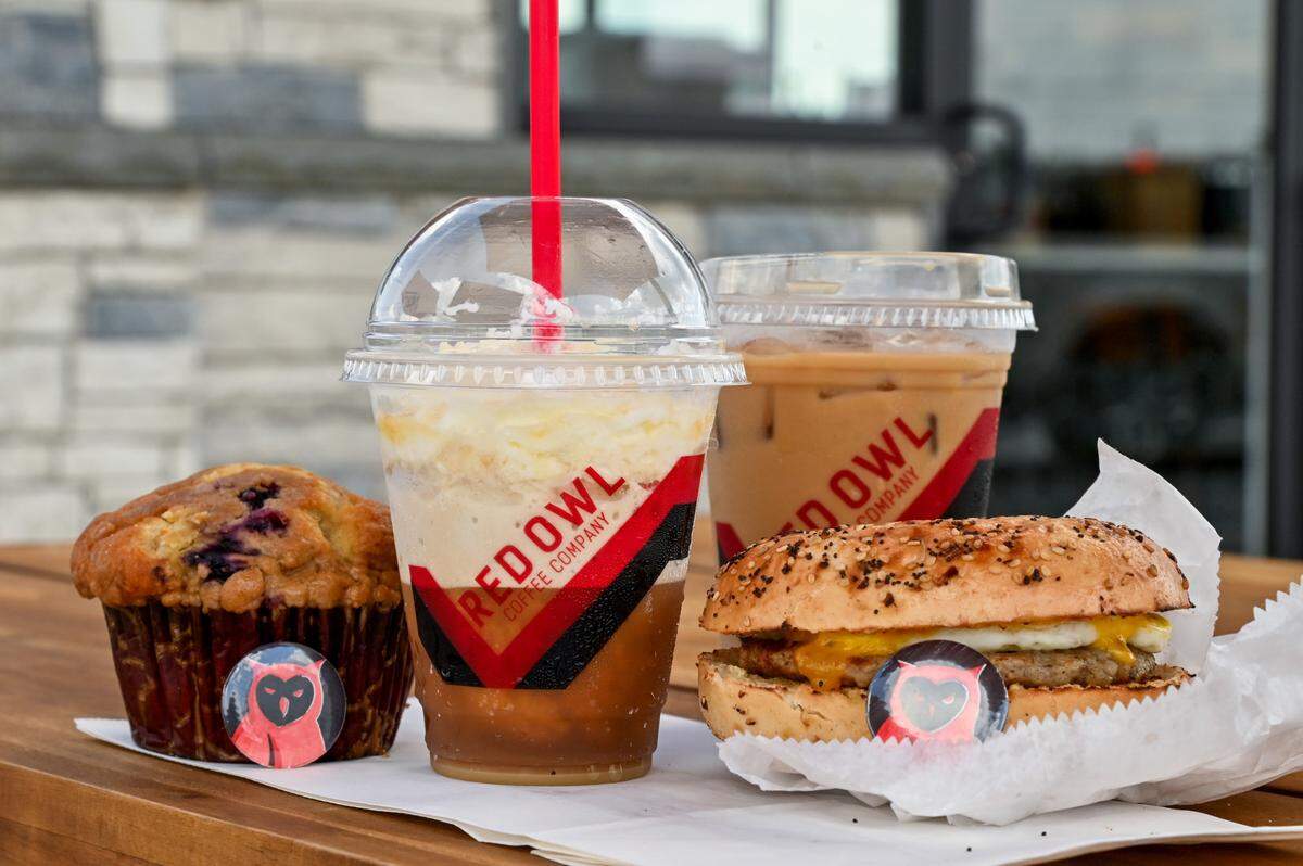 White mocha gulit free frappe and Dosta Double with sausage, egg and cheese Bowser Bagel and blueberry muffin at Red Owl Coffee in Macon.