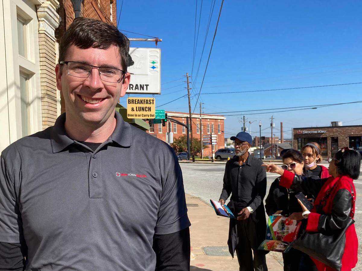 Josh Rogers, president and CEO of NewTown Macon, talks about the 2022 Tour of Progress while tour participants take a look at the Billingslea Commons development in the 800 block of Forsyth St. in downtown Macon.