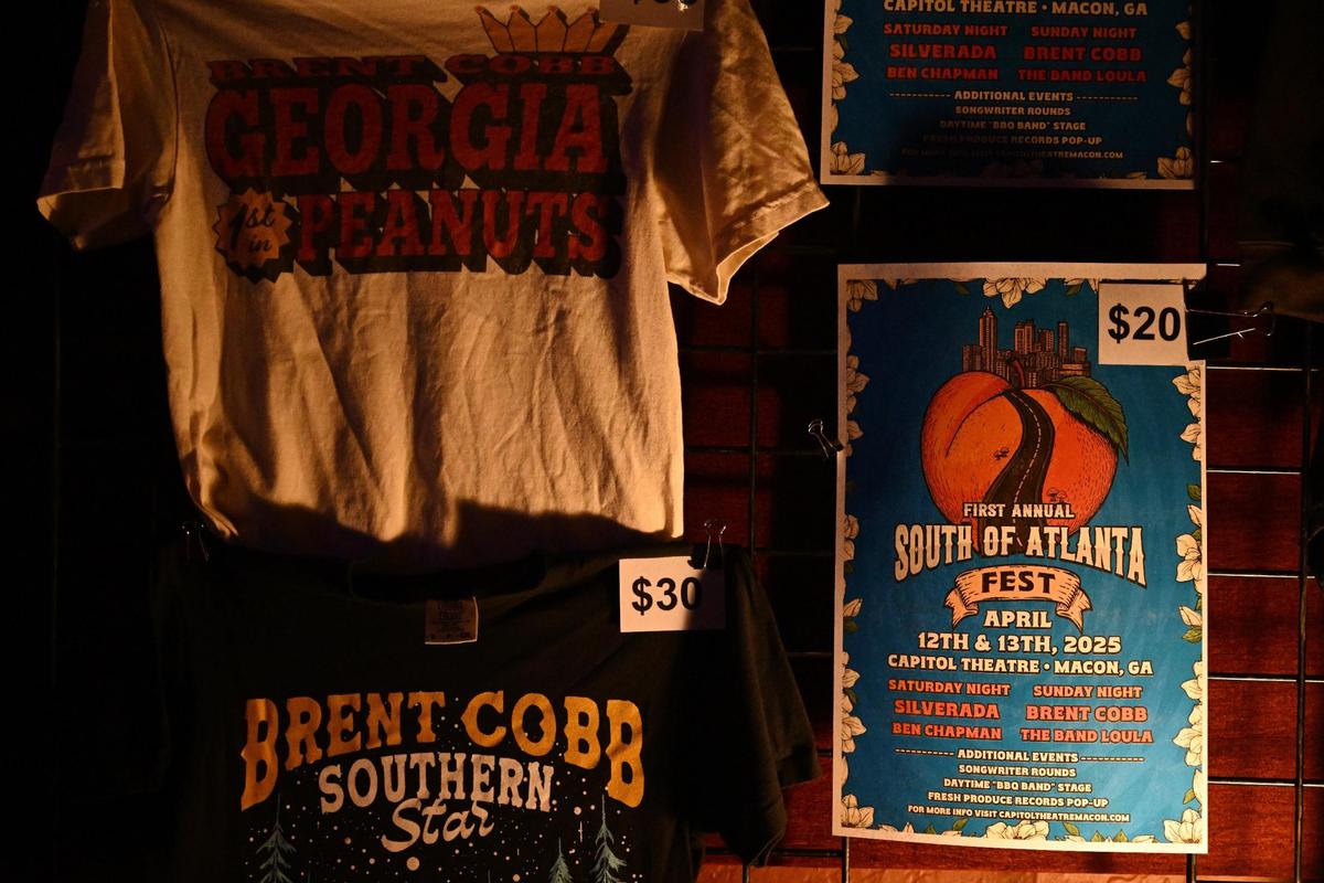 Merchandise for Brent Cobb and the inaugural South of Atlanta fest hangs on Sunday, April 13, 2025, at the Capitol Theatre in downtown Macon, Georgia. Grammy-nominated country artist Brent Cobb organized and headlined the two day music festival in Macon, highlighting local and state artists.
