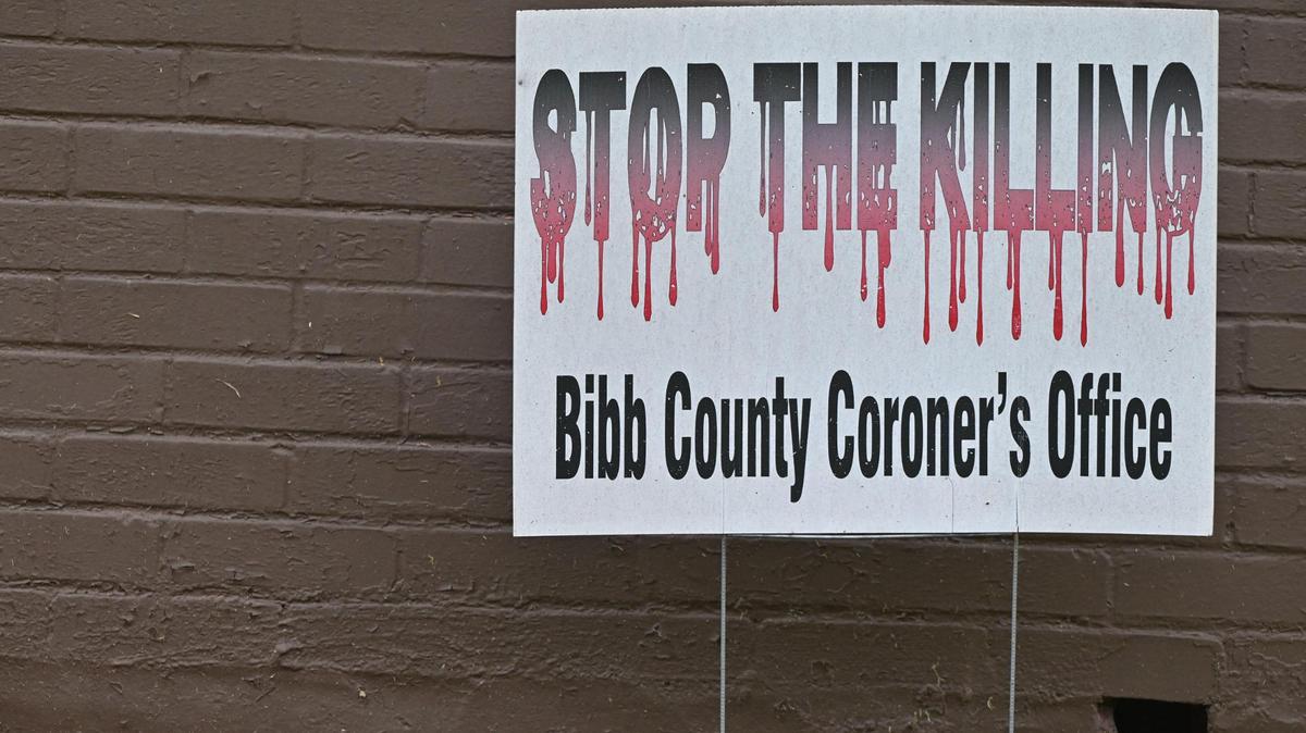 A “Stop The Killing” sign from the Bibb County Coroner’s Office sits in a front yard off of Adams Street on Wednesday, July 9, 2025, in Macon, Georgia. Homicides in Macon have decreased from