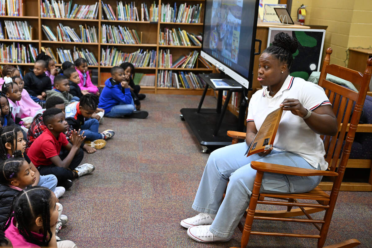 Jessica Ramsey reads her book “Feelings without Words: A Child’s Guide to Expression” to students on Friday, Jan. 9, 2026, at L.H. Williams Elementary School in Macon, Georgia. Ramsey competed in the 2021 Tokyo Olympics for Team USA in shot put and toured Bibb County schools to share her new children’s book on teaching children to express their emotions in healthy ways.