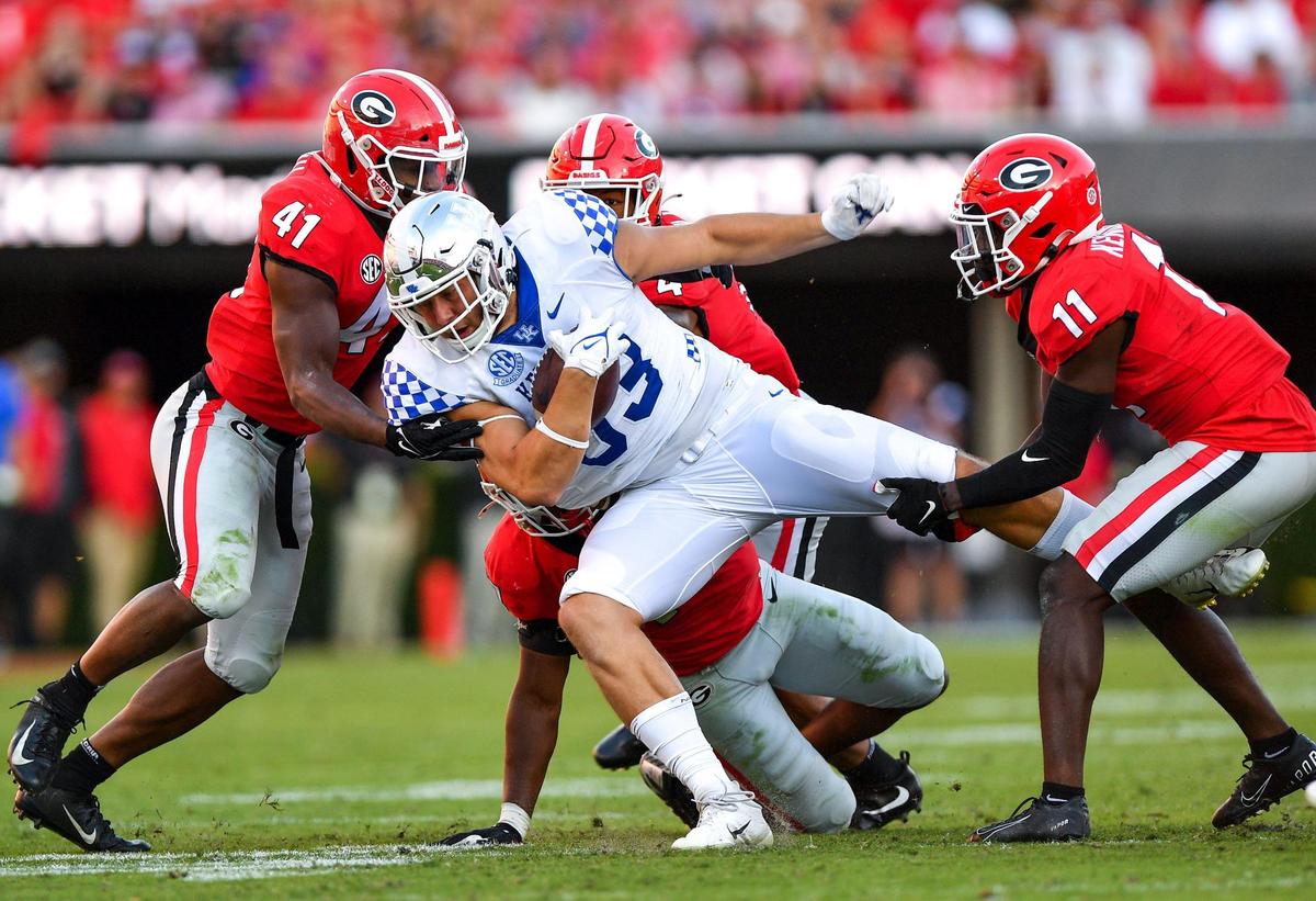 DONN RODENROTH,Athens, Georgia, 10/16/2021: a host of Bulldog defender haul down Kentucky running back Travis Tisdale Saturday in Athens.