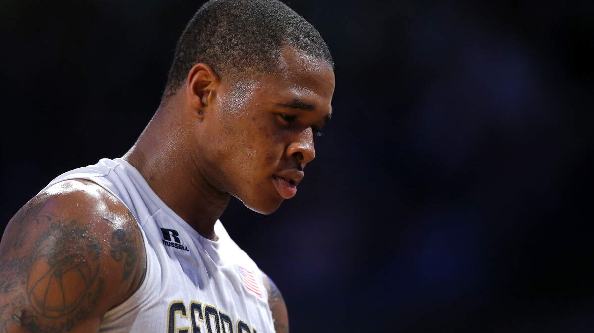 Georgia Tech guard Marcus Georges-Hunt heads to the bench to get checked out after an injury during the first half of the team's NCAA college basketball game against Notre Dame in Atlanta, Saturday, Feb. 20, 2016. Georgia Tech won 63-62. (AP Photo/Todd Kirkland)