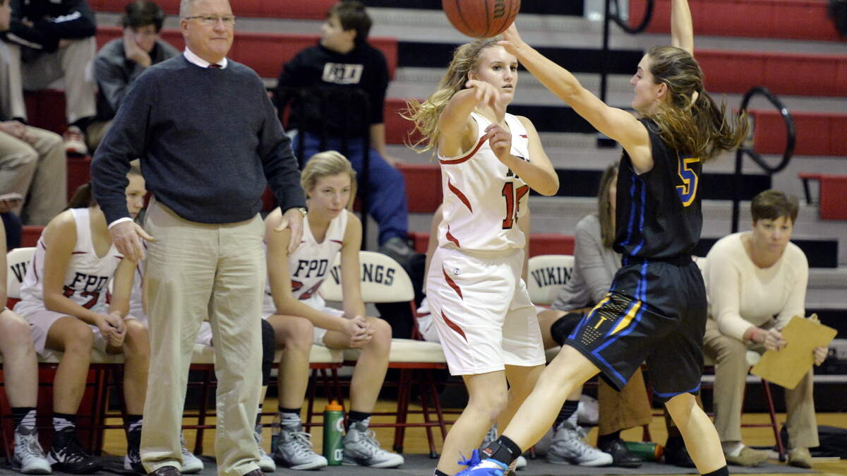 FPD guard Sadie Frame (14) passes to a teammate while being pressured by Tattnall's Jordan Allen (5) during their game Tuesday night.