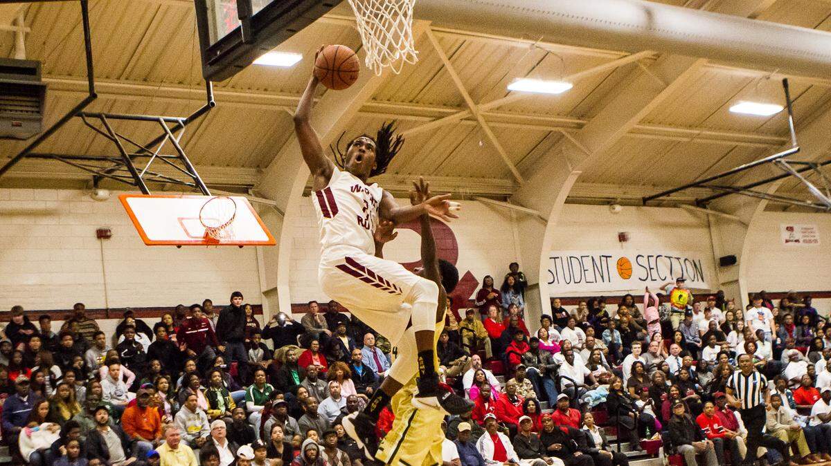 Warner Robins' Marquez Callaway (24) is fouled while shooting against Ware County in the first round of the GHSA Class AAAAA basketball playoffs.