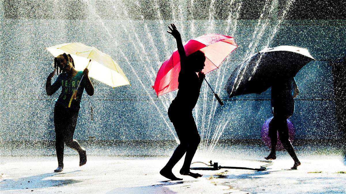 A Telegraph file photograph from summer 2014 shows sisters Kendreyana, 9, and Rokajai Mitchell, 7, playing with their friend Ava Hollis, 8, in Hollis’ grandmother’s driveway on Pierce Drive West. The girls circled a water sprinkler to keep cool on a hot day.
