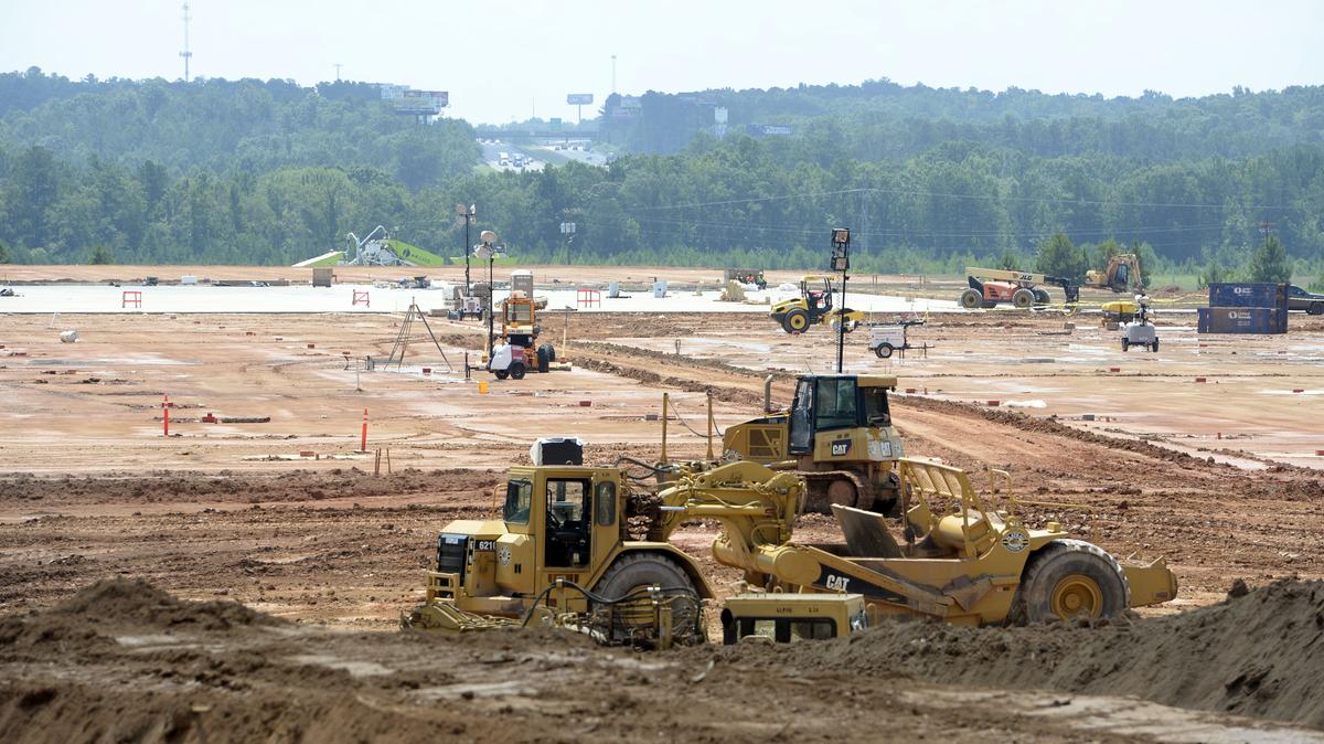 With Interstate 75 in the background, crews grade the parking lots around a slab that will soon be the base for a large Five Below distribution center in the Meridian 75 Logistics Center in southern Monroe County.