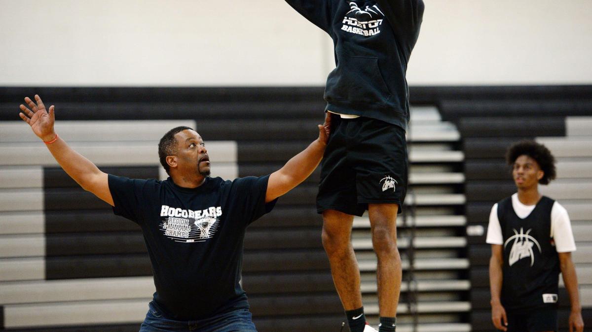 BEAU CABELL/THE TELEGRAPH Warner Robins, Ga., 02/14/2019: Houston County coach Don Hudson, left, works with his seniors on outside shooting drills as he prepares his team for a run in the GHSA tournament.