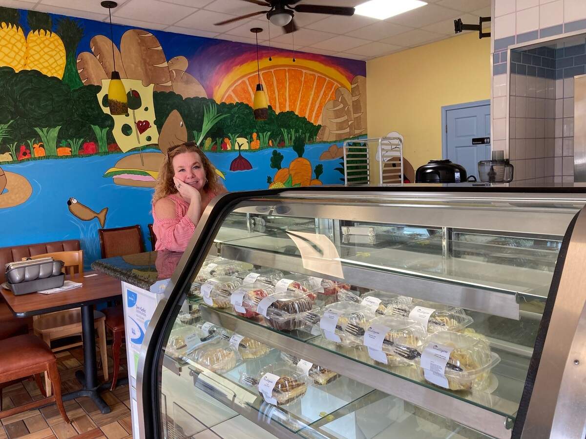 Sheri Marshall, a traveling nurse, picks up four different cake slices at Layers at 3001 Vineville Ave. in Macon to take back to the office at Piedmont North where she’s currently working.