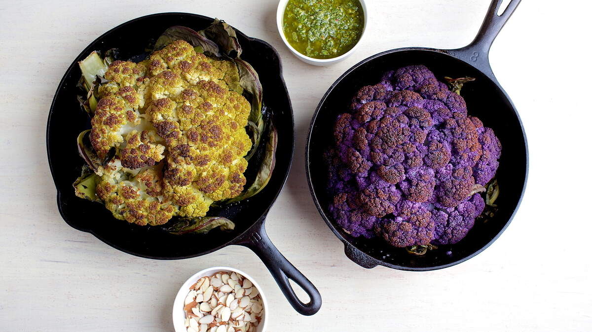 Whole roasted Cauliflower with Chimichurri and Almonds can be the centerpiece of your Thanksgiving table.