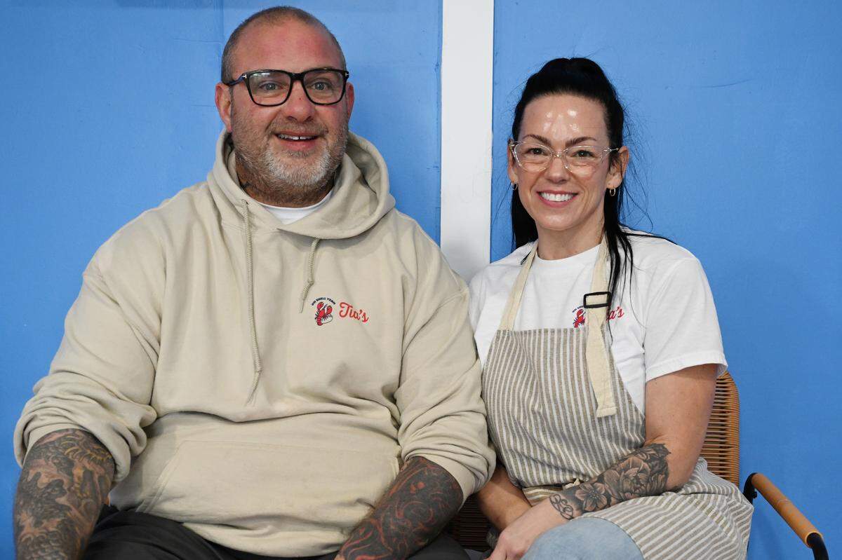 Husband and wife Chris (left) and Tia Small pose inside their restaurant Tia’s Maine Lobster Rolls in Warner Robins. The couple, both originally from Maine, moved to Georgia in search of a warmer place to live.