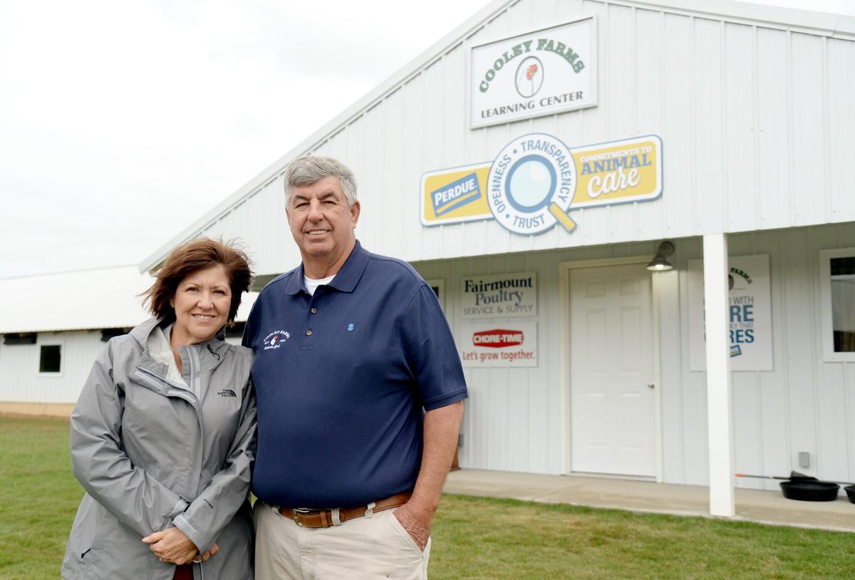 Larry and Terri Cooley outside their new Poultry Learning Center at Cooley Farms in Crawford County.