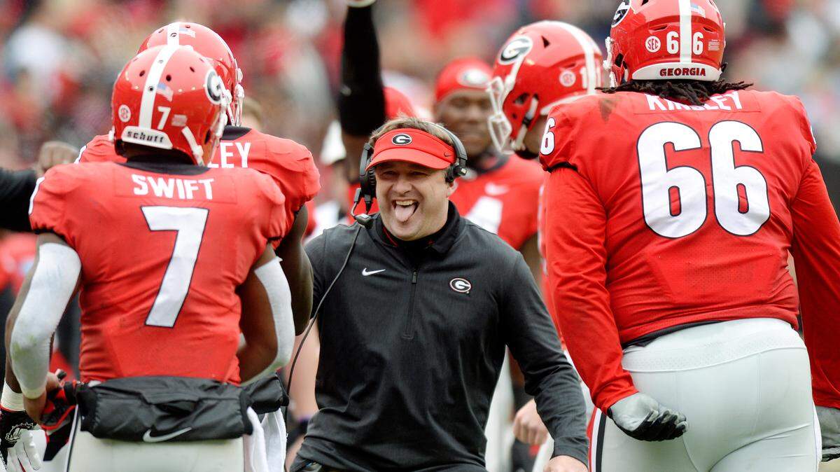 Georgia head coach Kirby Smart congratulates the Bulldog offense after a second quarter touchdown by Mecole Hardman (4) in their 45-21 win over Georgia Tech.