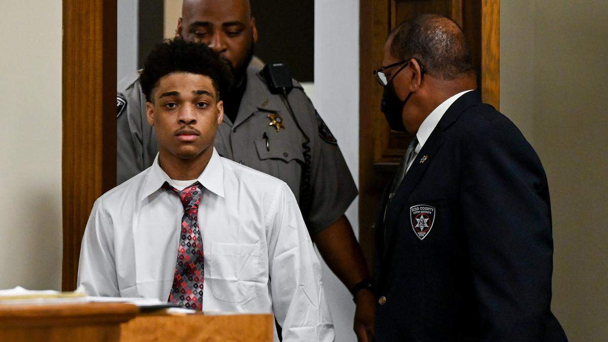 Jeremy Kendrick Jr. is escorted into a Bibb County Superior courtroom during his murder trial Thursday afternoon. Kendrick Jr. is charged in the holdups and killings of the clerks, who were slain a week apart in August 2018.