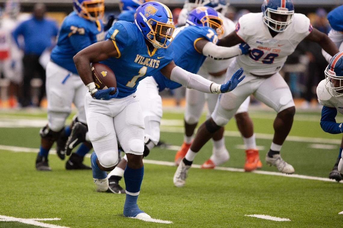 Fort Valley State running back Emanual Wilson (1) throws a stiff arm in a 2021 game against Savannah State University. Wilson is on the watch list for this year’s Black College Football Player of the Year Award.