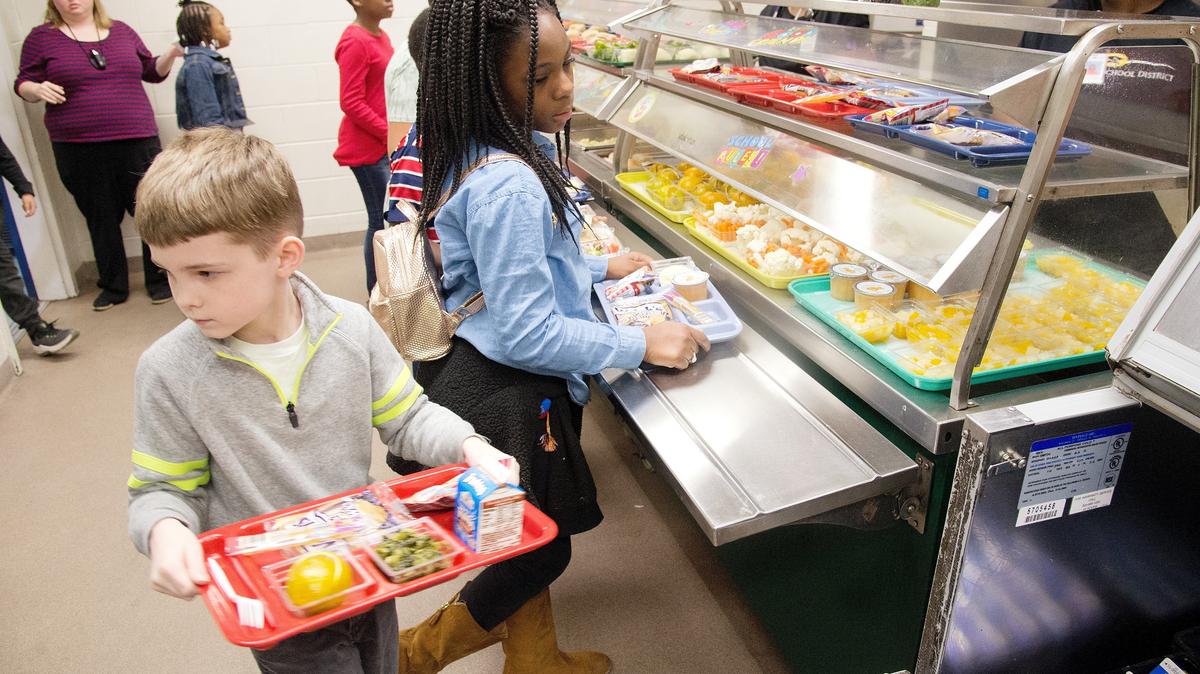 JASON VORHEES/THE TELEGRAPH Macon, GA, 03/23/2018: Students at Alexander II walk through the lunch line March 23 in the school’s cafeteria.