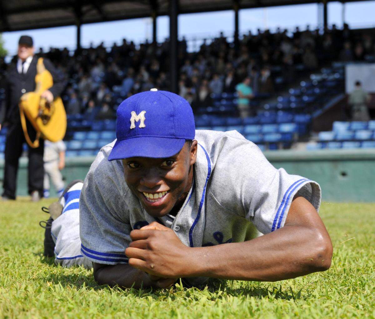 Chadwick Boseman, in the role of Jackie Robinson in the Jackie Robinson biopic “42,” plays around with the news photographer between scenes at Luther Williams Field in Macon, GA, on Wednesday, June 20, 2012 in Macon, GA. The historic baseball field was temporarily renamed City Island Park for the film’s production.