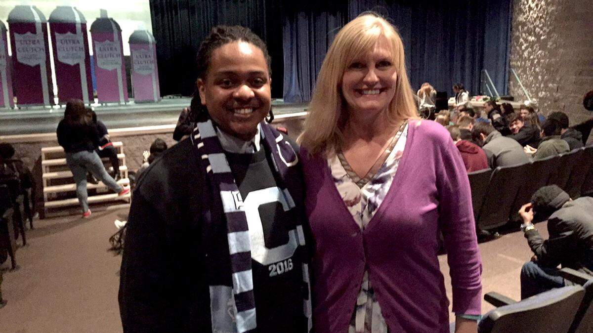 Northside High School grad Johnny Fells III poses for a picture with his former teacher Kim Stewart