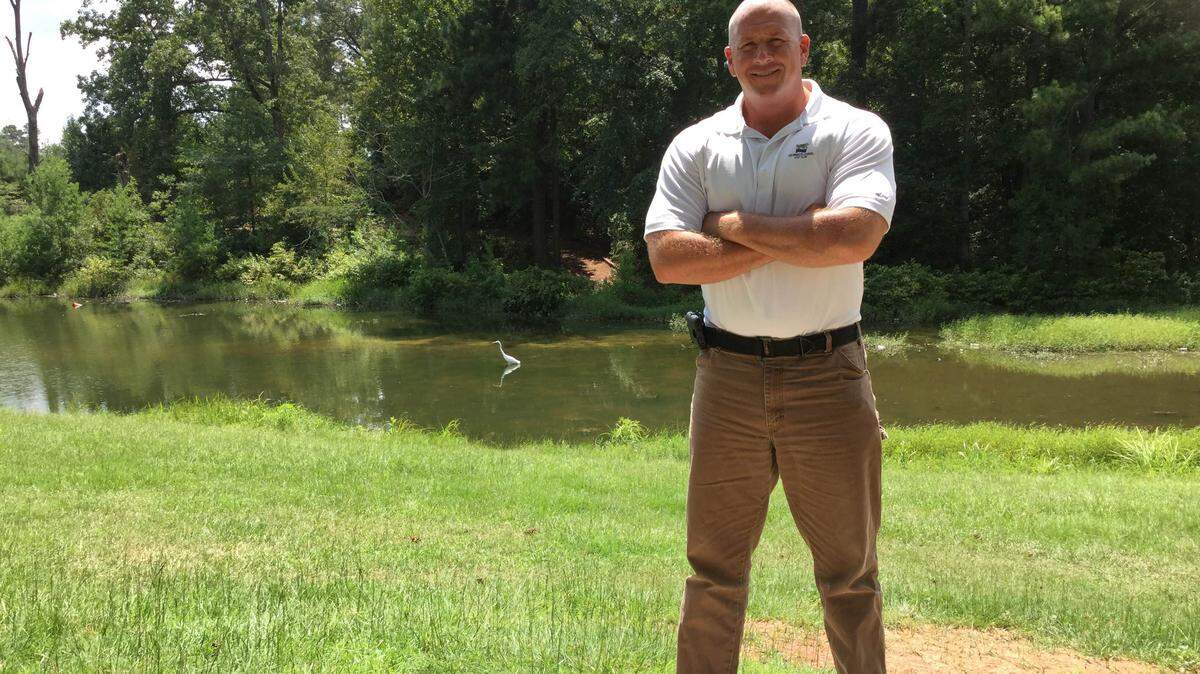 LAURA CORLEY/THE TELEGRAPHKevin Dye, Perry’s new director of leisure services, stands in front of a pond at Rozar Park. Dye has plans to improve recreation and culture in the city.