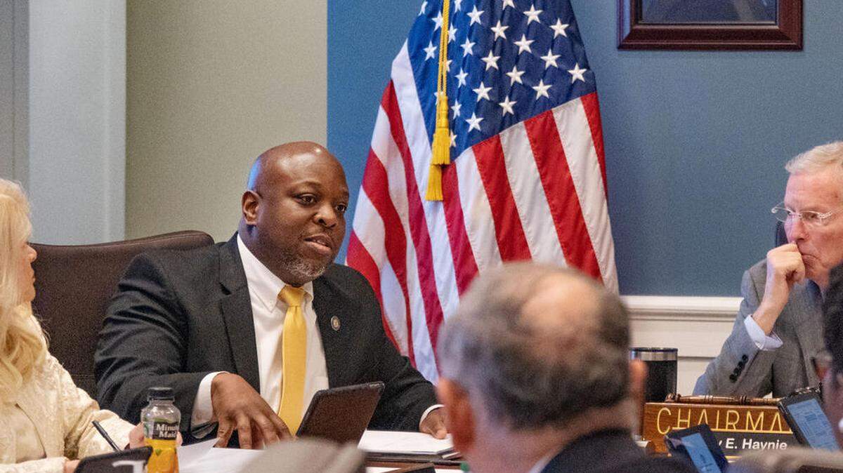 Commissioner Tyrone Oliver, second from left, speaks during a 2023 meeting of the Georgia Board of Corrections. In 2025, Oliver says low numbers of officers and high numbers of contraband-laden drones are pressing problems.
