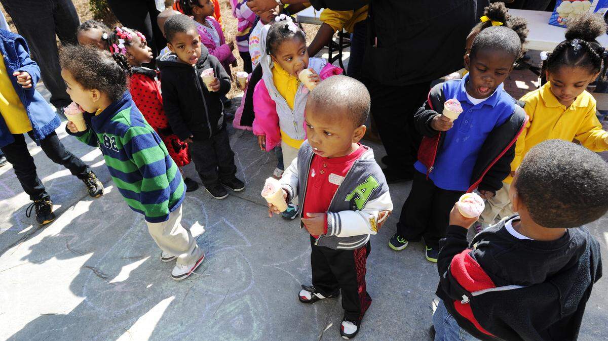 WOODY MARSHALL/THE TELEGRAPHChildren eat cherry ice cream cones at a previous year's Third Street Park Festivities.