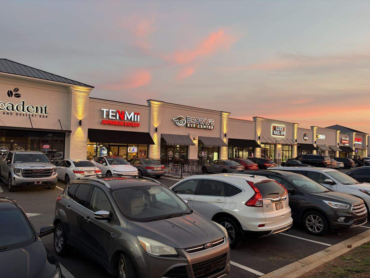 A popular shopping center at 1012 Ga. 96 on Friday night March 20, 2026. The owners are developing the site adjacent to it for a possible restaurant as well as a shopping center.