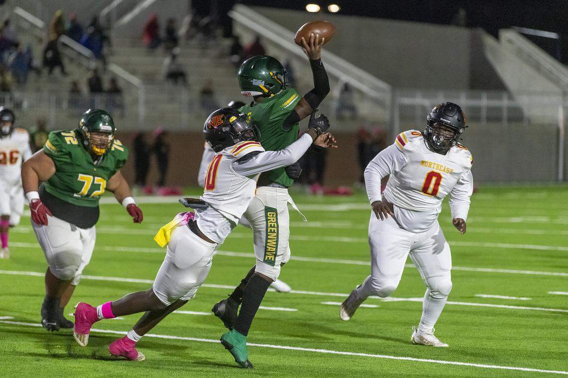 Northeast’s Keandre Hunter tackles Spencer’s Gary Gaither Friday night breaking up a pass play in the first quarter of the game at Odis Spencer Stadium in Columbus.