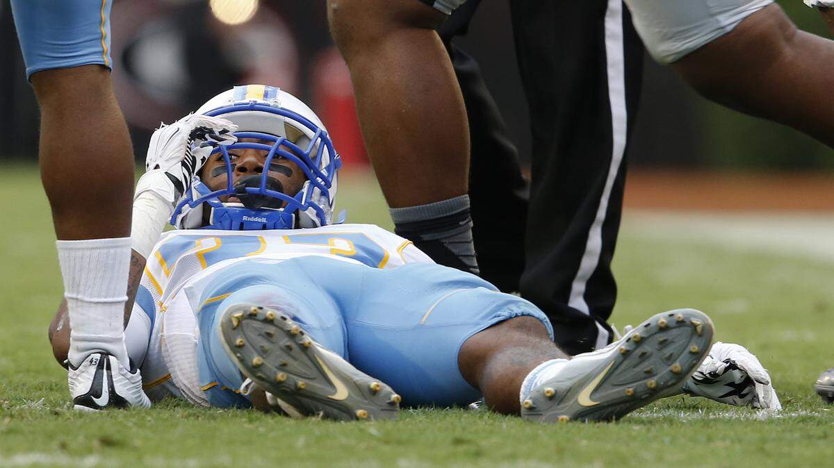 Southern wide receiver Devon Gales (33) lies on the turf after being injured in the second half of an NCAA college football game against Georgia Saturday, Sept. 26, 2015, in Athens. Gales was placed on backboard and taken off the field on a cart.