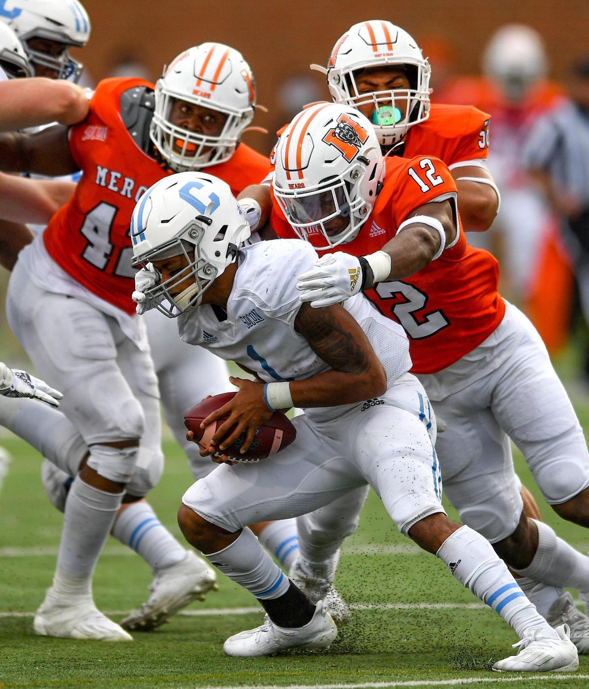 DONN RODENROTH,Macon, Georgia, 02/27/2021: Citadel quarterback Jaylan Adams gets sacked by the Mercer defense Saturday in Macon. Mercer defeated The Citadel 42-28.